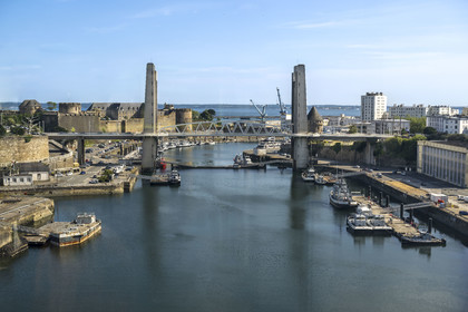 France, Finistère, Brest, the arsenal, the military port is a naval base of the French Navy, the Recouvrance bridge, the castle which houses the National Maritime Museum at the mouth of the Penfeld river and the Tour de la Motte-Tanguy in the background