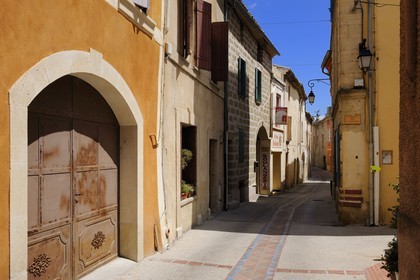 France, Gard, region of the Pays d'Uzege, Saint-Quentin-la-Poterie, the Grand'Rue (main street), the water drainage are also tiled
