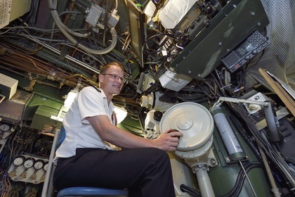 France, Var, Toulon, the naval base (Arsenal), Commander Nicolas Faure at periscope in the central navigation and operation room, Commander of the nuclear attack submarine (SNA) Casabianca (Rubis type)