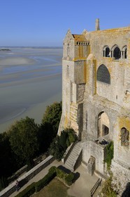 France, Manche, the abbey of Mont Saint Michel, listed as World Heritage by UNESCO, the north buildings (cloister, the knights room) overlooking the bay at low tide