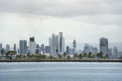Panama, Panama City, the waterfront and skyscrapers, the Causeway Islands (Calzada de Amador) in the foreground