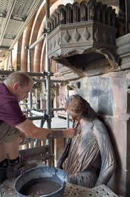 France, Bas Rhin, Strasbourg, old town listed as World Heritage by UNESCO, Notre Dame Cathedral, Judgment Day Portal Restoration Site, cleaning of the so-called Synagogue sculpture with a toothbrush by a stonemason companion