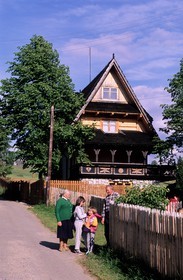 Poland, Lesser Poland, Carpathian Mountains, Zarcopane area, family of farmers in front of their wooden house