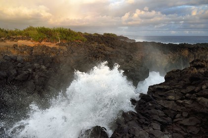 France, Reunion island (French overseas department), L'Etang Salé les Bains, at the place called Le Gouffre, long natural corridor formed by black basaltic rocks tormented by the ocean