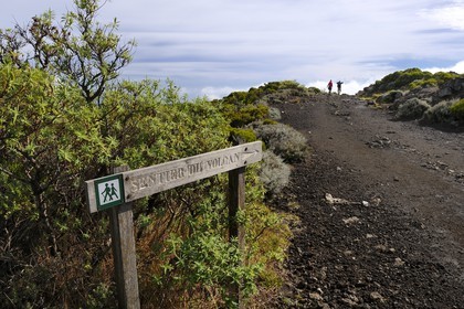 France, Reunion island (French overseas department), Piton de la Fournaise volcano, listed as World Heritage by UNESCO, hikers on the trail at the top of the Enclos