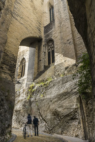 France, Vaucluse, Avignon, the rue de la Peyrolerie, a passage dug into the rock at the foot of the Palais des Papes (Palace of the Popes) classified as UNESCO World Heritage
