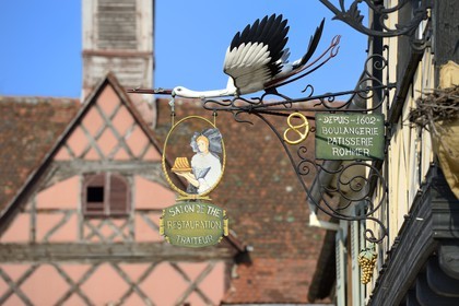 France, Bas Rhin, Rosheim village, bakery sign with a stork