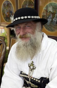 Poland, Lesser Poland, Carpathian Mountains, craftsman wearing traditional costume of his region