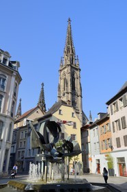 France, Haut Rhin, Mulhouse, Fountain Place des Victoires in the middle of the rue du Sauvage, St Etienne Temple in the background