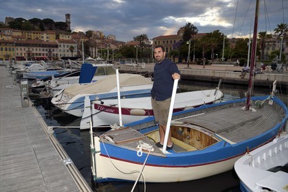France, Alpes-Maritimes, Cannes, Jeremy Crunchant owner of the oldest Pointu (traditional boat) in the harbor