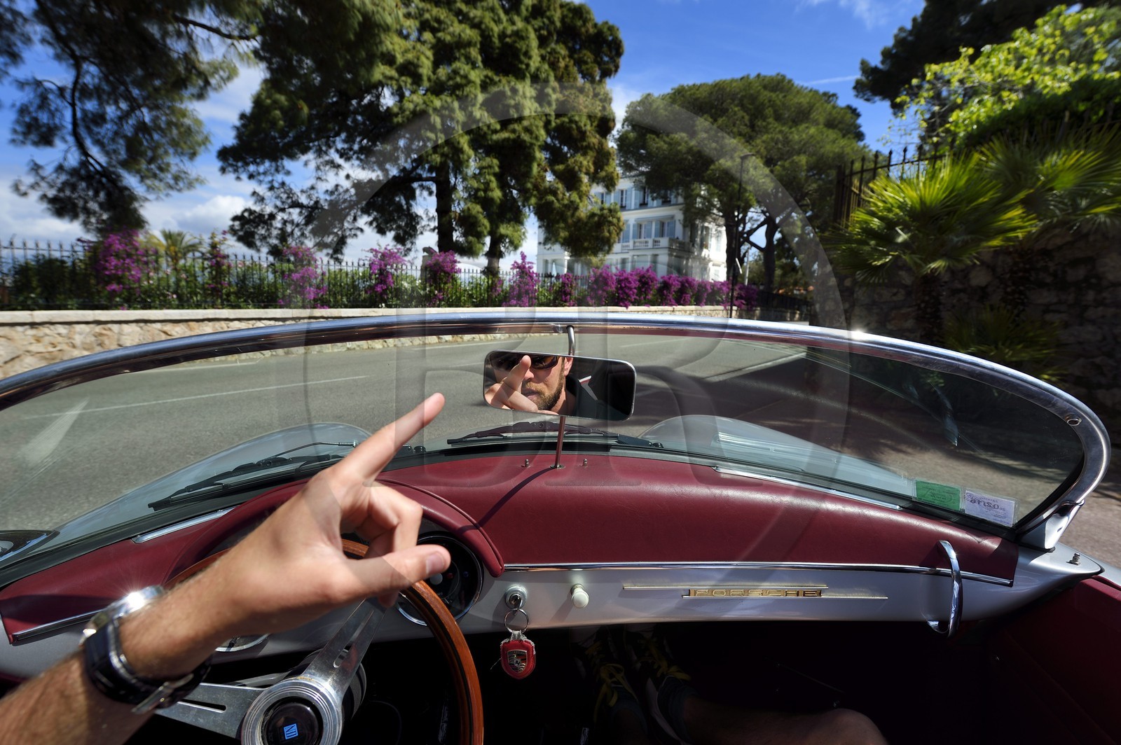 France, Alpes-Maritimes, Antibes, Cap d'Antibes, in the district of Eden Roc aboard a collection convertible Porsche Speedster 356, the villa Les Chênes Verts in the background