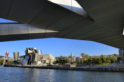 Spain, Basque Country Region, Vizcaya Province, Bilbao, the Guggenheim Museum designed by Frank Gehry seen from Pedro Arrupe footbridge by architect Jose Antonio Fernandez Ordonez, over the Nervion river