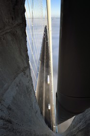 France, between  Calvados and Seine Maritime, the Pont de Normandie (Normandy Bridge) spans the Seine, opening in the pylon to pass a cable that supports the bridge