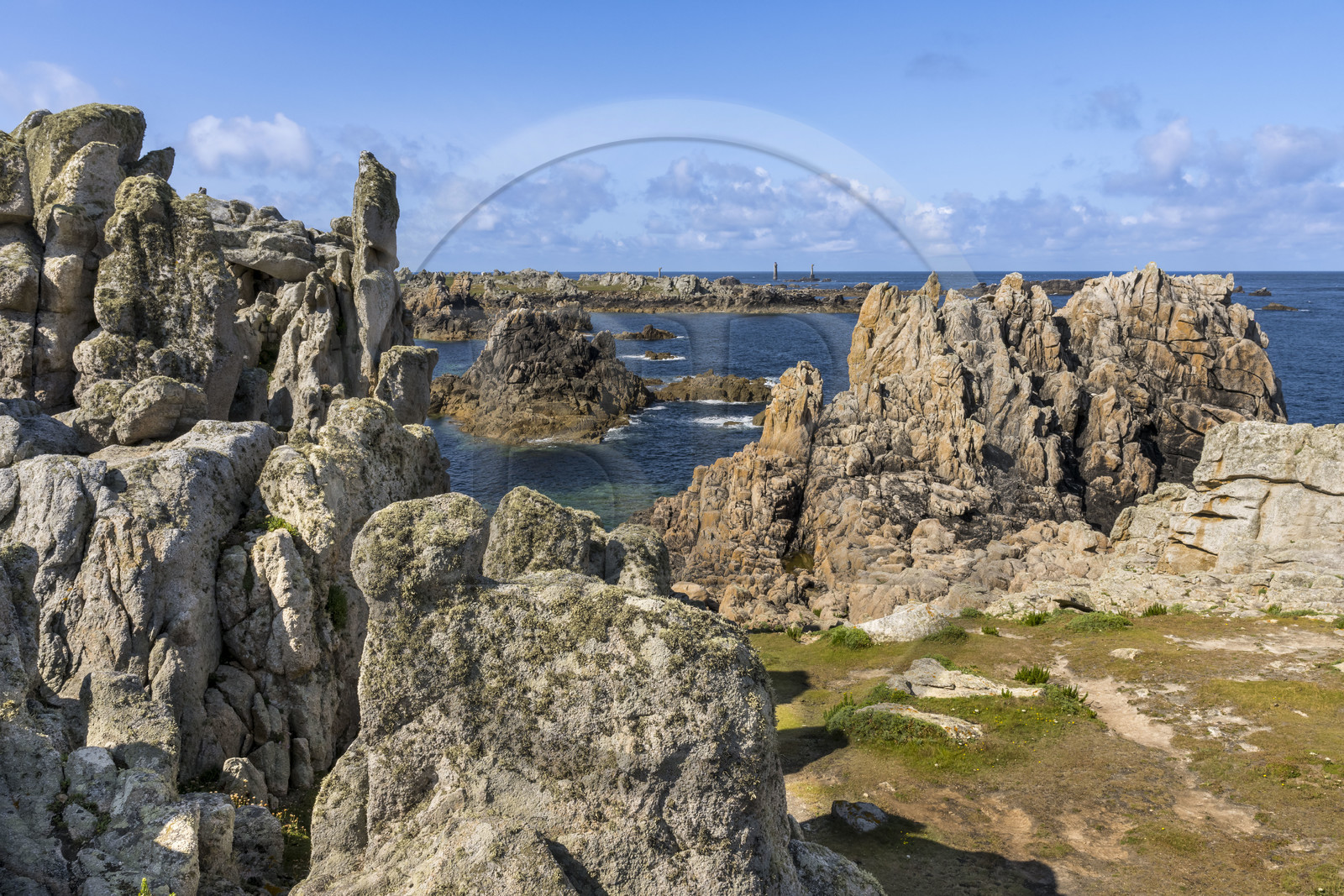 France, Finistère, Iroise Sea, Ouessant Island, rocks shaped by storms at the foot of the Creac’h lighthouse (aerial view)