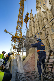 Spain, Catalonia, Barcelona, Eixample district, Sagrada Familia basilica by Catalan modernist architect Antoni Gaudi, listed as a UNESCO World Heritage Site, cloister construction site under the facade of the apse, largely still in neo-gothic style with its animal-shaped gargoyles, installation of reinforced concrete frame