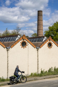 France, Vendee, Mallièvre, the Vendée Vélo Tour cycle route passes in front of the Couleurs et Textiles factory which symbolizes the city's weaving industrial history