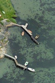 Sweden, County of Vastra Gotaland, Goteborg archipelago, Gäveskär island, boats moored at piers (aerial view)