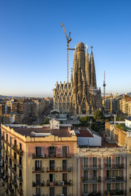 Spain, Catalonia, Barcelona, Eixample district, Sagrada Familia basilica by Catalan modernist architect Antoni Gaudi, listed as a UNESCO World Heritage Site, facade of the Nativity and the surrounding buildings