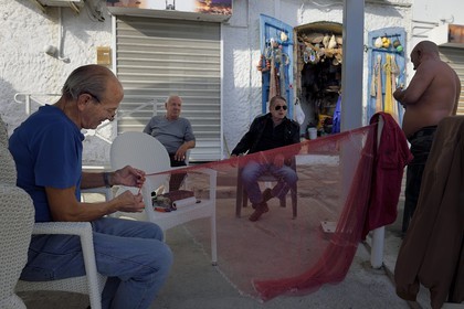France, Haute Corse, Bastia, Terra-Vecchia district, meeting of former fishermen at their headquarters on the Old Port