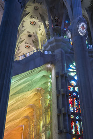 Spain, Catalonia, Barcelona, Eixample district, Sagrada Familia basilica by Catalan modernist architect Antoni Gaudi, listed as a UNESCO World Heritage Site, the warm colours created by the stained glass windows on the facade of the Passion by the Catalan painter and glassmaker Joan Vila-Grau