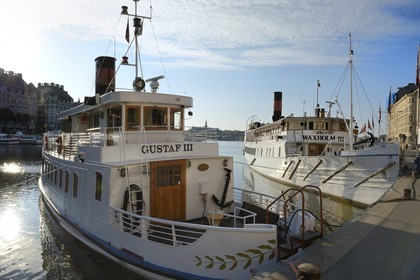Sweden, Stockholm, Norrmalm city center district, ferries moored at the Nybrokajen quay