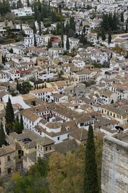 Spain, Andalusia, Granada, Albaicin District listed as World Heritage by UNESCO and San Pedro y San Pablo church seen from the Alhambra