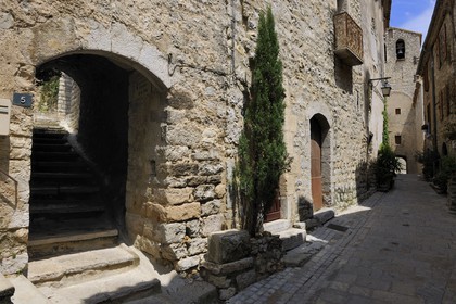 France, Herault, Pic Saint-Loup region, Les Matelles village, the gate of the Ramparts in the back