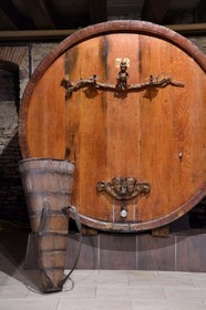 France, Bas Rhin, the Alsace Wine Route, Mittelbergheim, labelized the Most Beautiful Villages of France, 16th century underground cellars of the Wine estate GILG, centenary large barrel