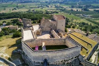 France, Vaucluse, Parc Naturel Regional du Luberon (Natural Regional Park of Luberon), Lourmarin, labelled Les Plus Beaux Villages de France (The Most Beautiful Villages of France), Lacoste, Lacoste castle, one of the residences of the Marquis de Sade and nowadays owned by Pierre Cardin, silhouette of the Divine Marquis (aerial view)