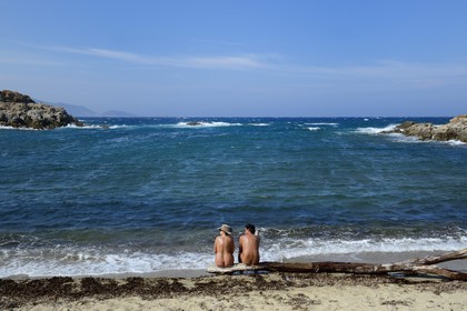 France, Haute Corse, Nebbio, Agriates Desert, Peraiola Cove, Nudist couple on a small beach in the East of Ostriconi beach