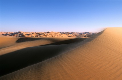 Libya, Fezzan (Sahara), Mourzouk Erg (Murzuq), wind of sand on the ridge of dunes