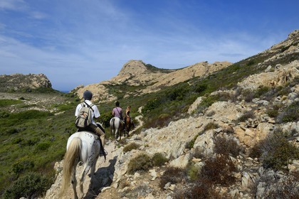 France, Haute Corse, Nebbio, riders trekking in the Agriates Desert