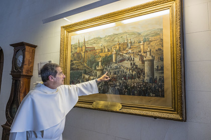 France, Bouches du Rhone, Tarascon, La Montagnette, Saint-Michel de Frigolet abbey (12th century), the Virgin Mary at the end of the tree-lined path le frère Jean-Charles, l’un des cinq chanoines réguliers Prémontrés de l’abbaye, pointe le tableau représentant l'expulsion des religieux Prémontrés de l'abbaye en novembre 1880