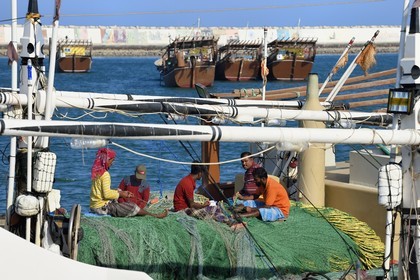 Sultanate of Oman, Ash Sharqiyah Governorate, modern port of Sour, fishermen on a dhow