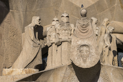 Spain, Catalonia, Barcelona, Eixample district, Sagrada Familia basilica by Catalan modernist architect Antoni Gaudi, listed as a UNESCO World Heritage Site, Gaudi (left) embodied in the figure of an evangelist by the sculptor Subirachs