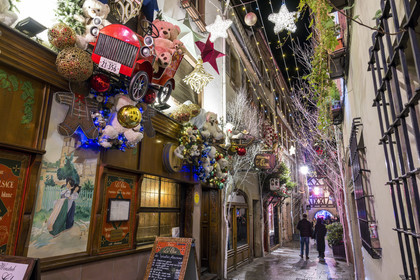 France, Bas Rhin, Strasbourg, old town listed as World Heritage by UNESCO, the winstub Le Clou in the rue du Chaudron with its Christmas decorations