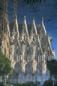 Spain, Catalonia, Barcelona, Eixample district, Sagrada Familia basilica by Catalan modernist architect Antoni Gaudi, listed as a UNESCO World Heritage Site, reflection in the pond of the facade of the nave on the east side