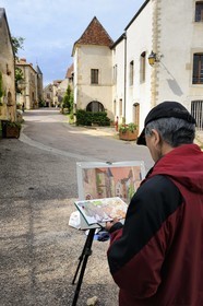 France, Cote d'Or, Chateauneuf en Auxois, labelled Les Plus Beaux Villages de France (The Most Beautiful Villages of France), amateur painter in the main street
