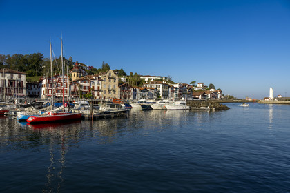 France, Pyrenees Atlantiques, Basque Country coast, Ciboure, the birthplace of Maurice Ravel (in stone) and the bell tower of the Saint-Vincent church on the edge of the port