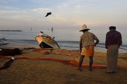 Sri Lanka, Western Province, Negombo, fishermen sorting their nets on the Porathota beach