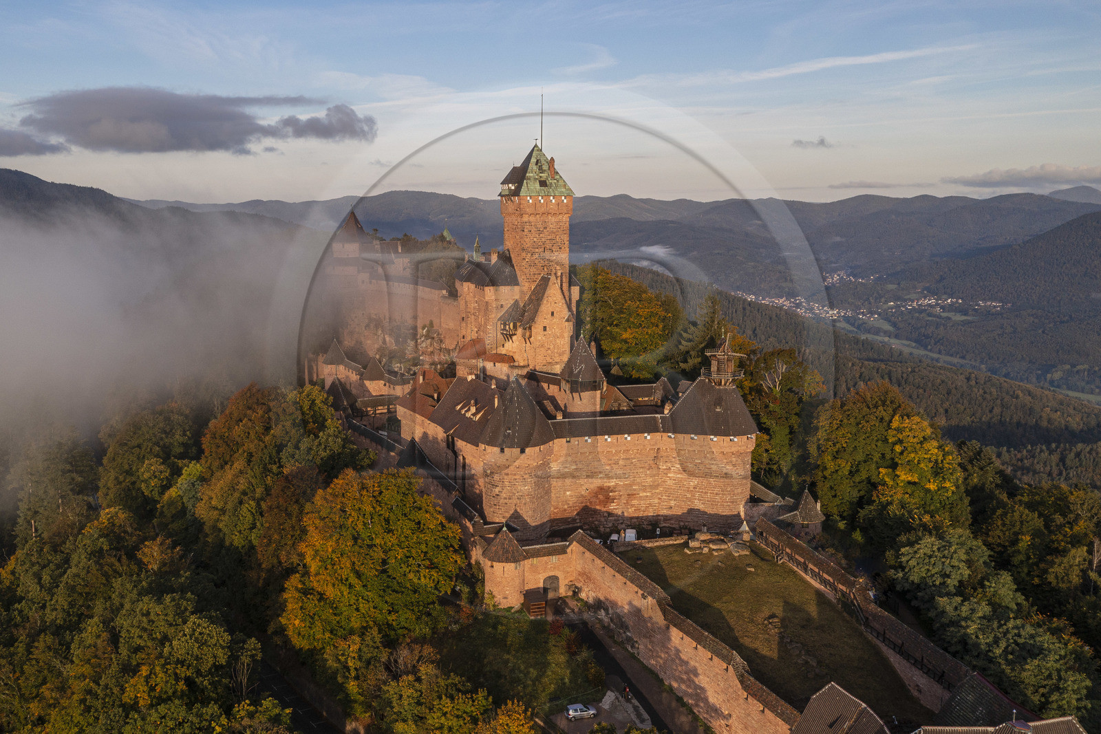 France, Bas Rhin, Orschwiller, Alsace Wine Road, the Haut Koenigsbourg Castle positioned on the Vosges foothills and overlooking the plain of Alsace to the east as well as the Villé and Bruche valleys to the west in the background (aerial view)