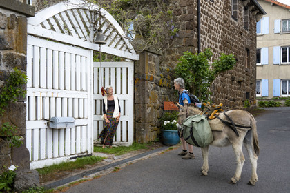 France, Haute-Loire (43), Bouchet-Saint-Nicolas, hiking with a donkey on the Robert Louis Stevenson Trail (GR 70), Marie welcomes us to her guest house Le Potala