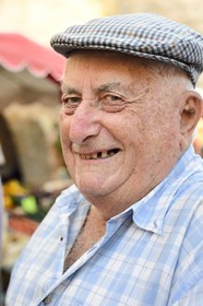 France, Dordogne, Perigord Pourpre, Monpazier, labelled Les Plus Beaux Villages de France (The Most Beautiful Villages in France), market day on the place des Cornieres, mister Vielmon one of the village elders