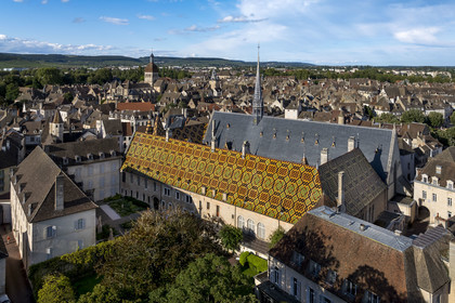 France, Cote d'Or, Beaune, area listed as World Heritage by UNESCO, Hospices de Beaune, Hotel Dieu, the Notre-Dame de Beaune collegiate basilica and the Côte de Beaune in the background (aerial view)