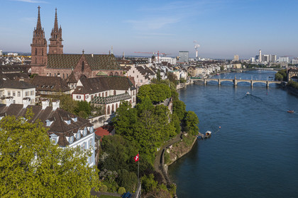 Switzerland, Basel, the left bank of the Rhine, the Minster or Protestant Cathedral of Our Lady of Basel (Munster) overlooking the Rhine, the Mittlere Brucke bridge in the background (aerial view)