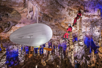 France, Gard, Mejannes-le-Clap, grotte de La Salamandre (Salamander cave), abseiling and discovery of the cave in Aéroplume®, an individual dirigible balloon inflated with helium which allows you to fly away by flapping your wings