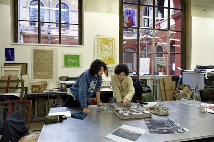France, Paris, Saint Germain des Pres district, Ecole nationale superieure des Beaux-Arts (Fine Arts school), printing-multiple department in the Palais des Etudes (Palace of Studies), students in front of a lithography stone