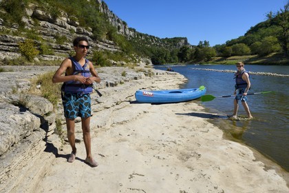 France, Ardeche, Balazuc, kayaks going down the Ardeche River between Balazuc and Pradons
