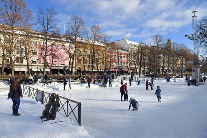 Norway, Oslo, Eidsvoll Square along Karl Johan street, Spikersuppa ice skating rink, children ice skating