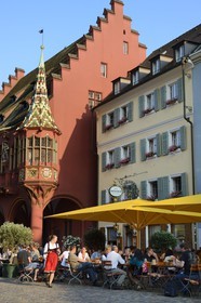 Germany, Baden-Wurttemberg, Freiburg im Breisgau, the Historical Merchants Hall of the early 16th century on the Munsterplatz and Terrace of the restaurant Oberkirch